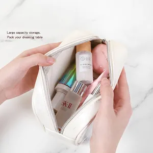 Large cream leather toiletry bag with wide opening and spacious waterproof interior