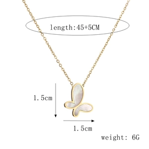 Macro view of butterfly pendant with white shell inlay and 45cm gold chain details