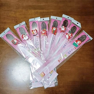 Detail view of seven LED flash braids with Santa Claus motif in individual packaging