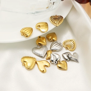 18K gold plated stainless steel heart pendants in various styles on white silk background
