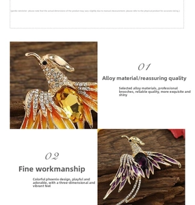 Detailed macro of phoenix brooches with rhinestones and enamel on a wooden surface