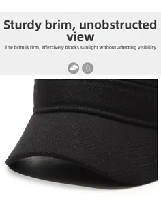 Detail view of the sturdy brim on a thick black winter flat cap for elderly men