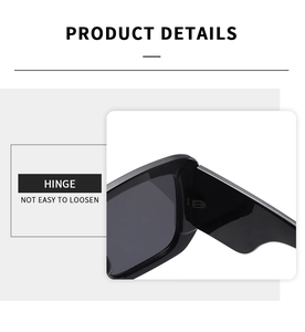 Close-up of durable metal hinge on black oversized Y2K sunglasses for smooth opening