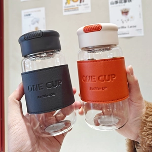 Minimalist glass tea infuser bottle with leather sleeve in black and orange styles
