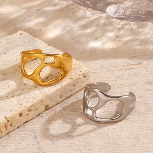 Minimalist irregular hollow open rings in 18K gold and silver finishes on stone