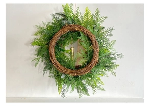 Detailed view of artificial cypress Christmas wreath with pinecones and golden bell