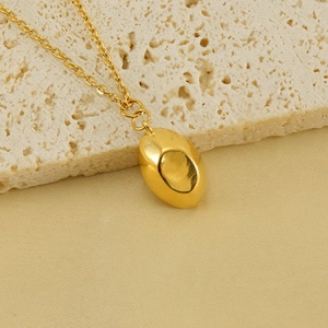 Polished 18k gold plated stainless steel necklace with oval pebble pendant on white rock