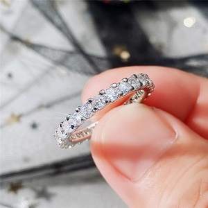 Macro shot of silver sparkling full eternity ring with round brilliant cut cubic zirconia