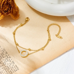 Double-layer gold stainless steel chain bracelet with a sparkling crystal paved circle charm