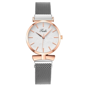 Women's quartz watch with leaf-pattern dial and silver mesh magnetic band