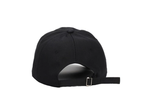 Close-up of black cotton baseball cap back with adjustable strap and metal buckle