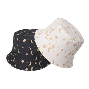 Detail of heart, star and moon prints on reversible sun hats in black and white
