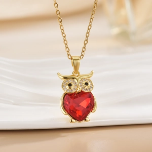 Minimalist owl necklace with a red heart-shaped crystal pendant in a gold-plated finish