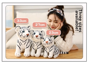 Three sizes of realistic white tiger plush toys shown in a cozy home setting decor