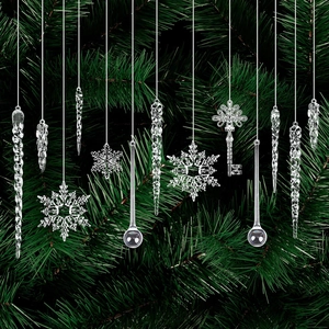 Clear acrylic Christmas ornaments set with snowflakes and icicles on pine branches