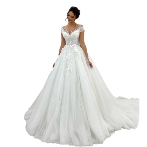 Elegant white ball gown wedding dress with lace floral appliques and a long train