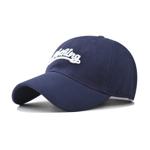 Detail of 3D white nothing embroidery on dark blue cotton twill baseball cap