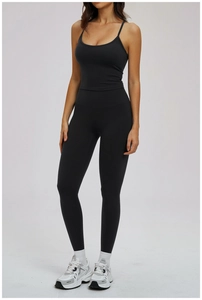 Women's black yoga set with high waist leggings and thin strap sports bra detail