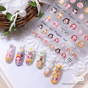 Detail of 3D embossed puppet doll nail art stickers showing various doll heads on nails