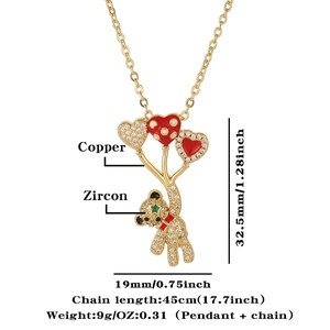Detail view of bear and heart zircon pendant showing dimensions 32.5mm by 19mm