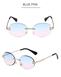 Detail of rimless sunglasses with blue-pink gradient lenses and gold metal frames