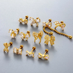 Golden bow cartilage earrings with sparkling cubic zirconia on a screw-back steel post