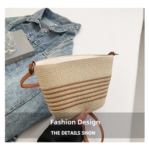 Detailed macro view of handmade beige straw bucket bag with brown stripes and lining