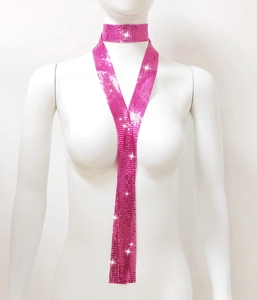 Detailed view of pink sequin mesh scarf with choker and long sparkling drape on a white bust