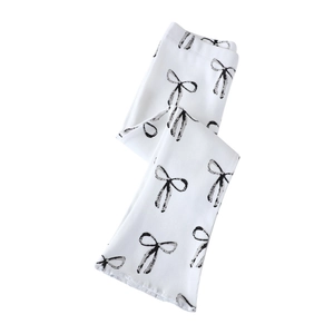 Pantalon évasé blanc en maille côtelée pour fille avec imprimés nœuds noirs en coton