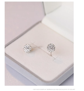 Close-up of S925 sterling silver shambhala ball earrings with micro-pave cubic zirconia