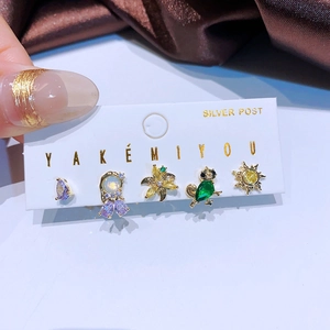 Five-piece gold earring set with colorful zircon and mixed geometric shapes on card