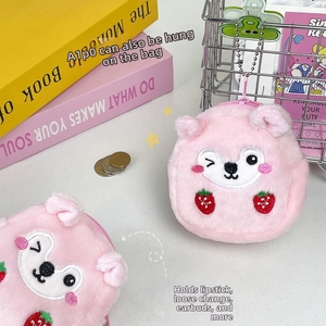 Detail of pink plush bear coin purse with embroidery, strawberry pattern and chain hook