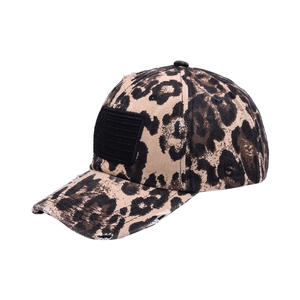 Detailed view of leopard print baseball cap with USA embroidery and black flag patch
