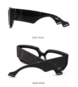 Detail view of bold rectangle glasses frames with dark marble pattern temples