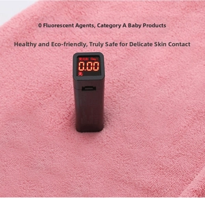 Macro shot showing zero fluorescence test result on pink coral fleece baby towel