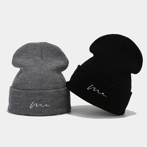 Minimalist knit beanie with 'me' embroidery in black and dark grey colors