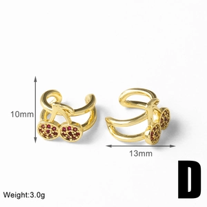 Detailed macro view of 18k gold plated cherry ear cuff with red cubic zirconia crystals
