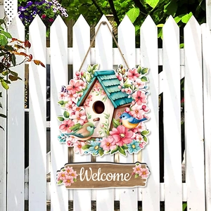 Spring farmhouse welcome door sign with floral birdhouse and birds on wooden fence