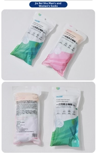 Detailed view of disposable cotton socks in portable green and pink travel packaging