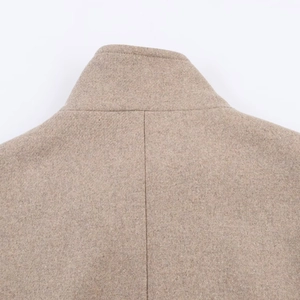 Back view of light brown wool coat featuring high collar and detailed stitching texture