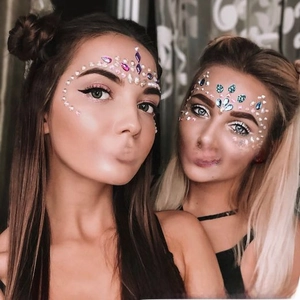 Detailed close-up of colorful acrylic face gems for festival makeup and art parties