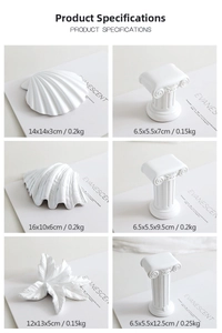 White plaster props including shells and Roman columns with dimensions for jewelry photography