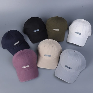 Detail view of cotton baseball caps with SURFING embroidery in various casual colors
