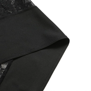Close-up of black lace and smooth fabric stitching on a slim fit bodycon dress