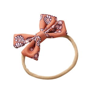 Floral bow baby headband with daisy pattern and soft elastic nylon band for infants