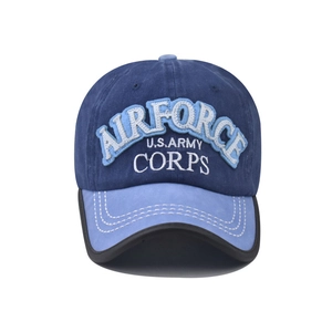 Close-up of AIRFORCE embroidery and white stitching on navy blue cotton baseball cap