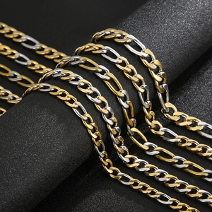 Two-tone silver and gold Figaro chain necklace and bracelet with a polished metallic finish
