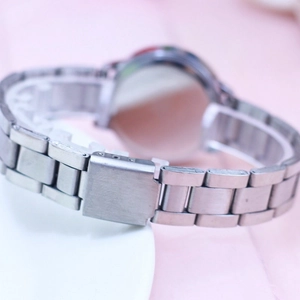Close-up of the silver metal strap and folding clasp on children's quartz watch