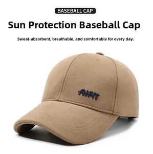 Close-up of high-density khaki cotton twill baseball cap with navy blue AHYT embroidery