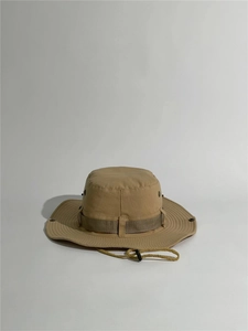 Detail of khaki outdoor bucket hat with adjustable chin strap and metal air vents